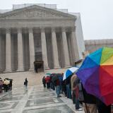 People wait to enter the Supreme Court in Washington on March 25, 2013. The justices will hear arguments on March 26 on California's Proposition 8 ban on same-sex marriage and on March 27 on the federal Defense of Marriage Act, which defines marriage as between one man and one woman.