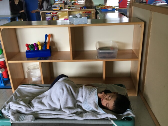 A toddler naps in his migrant and seasonal head start center in Balm, Florida. His parents are farm workers. 