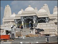 Workers finish construction on the stairs and the entrance to the temple. When completed, it will be the largest in the United States.