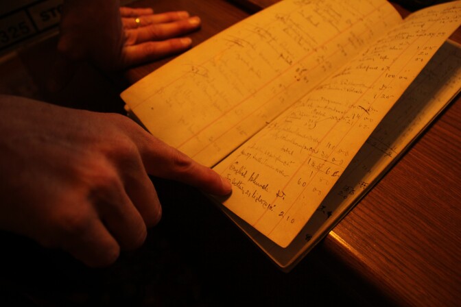 David Judson reads the ledger of his great-great-grandfather William Lees Judson. 