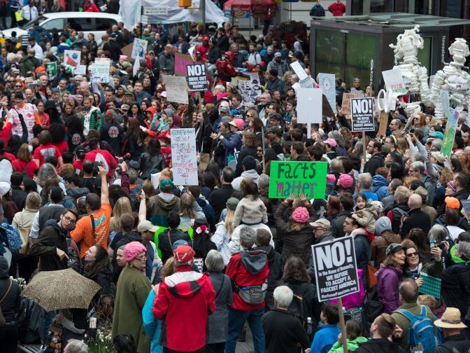 People with signs walk in Times Square during the March for Science on April 22, 2017 in New York. 
Thousands of people joined a global March for Science on Saturday with Washington the epicenter of a movement to fight back against what many see as an "assault on facts" by populist politicians. / AFP PHOTO / Bryan R. Smith        (Photo credit should read BRYAN R. SMITH/AFP/Getty Images)