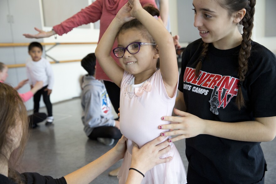 Volunteer Serena Ajemian works with Samantha Mora, 4.