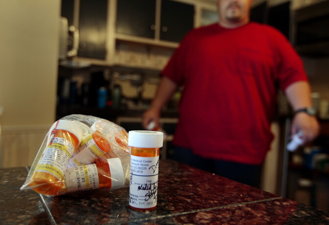 DENVER, CO - SEPTEMBER 08:  Bradley Hammond walks in his kitchen near some of the many prescription drugs he has been prescribed by doctors to help him cope with his PTSD September 8, 2009 in in Denver, Colorado. Hammond struggles with Post Traumatic Stress Disorder after his experiences in Iraq, where he was nearly killed several times and once was involved with the accidental shooting of an Iraqi family by U.S. troops.  (Photo by Chris Hondros/Getty Images)