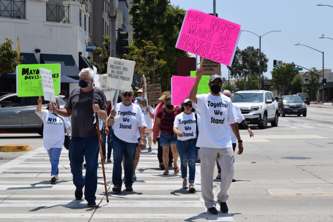 Protesters cross the street in Carson.