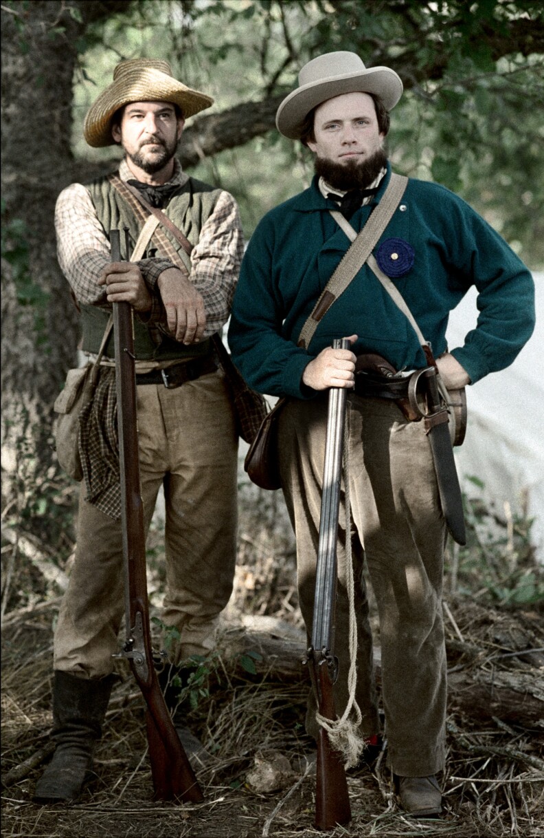 Two reenactors portray militia units at the 150th anniversary of the Battle of Wilson’s Creek in Missouri, close to the actual battlefield. The units sided with the Confederacy during the first year of the Civil War. 