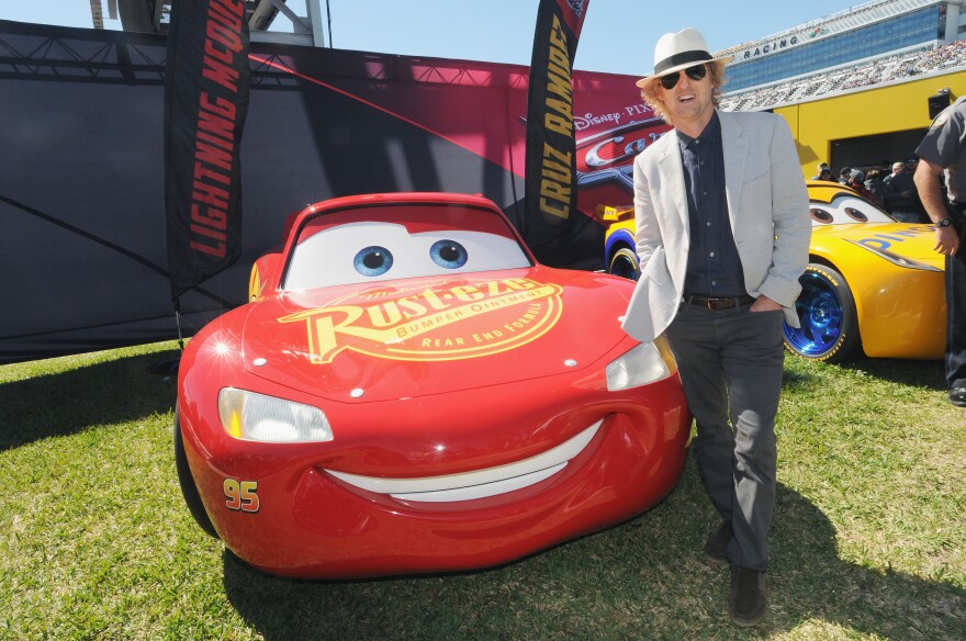 DAYTONA BEACH, FL - FEBRUARY 26:  Grand Marshal Owen Wilson, voice of Lightning McQueen in "Cars 3" poses with Lightning McQueen for the 59th Annual DAYTONA 500 at Daytona International Speedway on February 26, 2017 in Daytona Beach, Florida.  (Photo by Gerardo Mora/Getty Images for Disney)