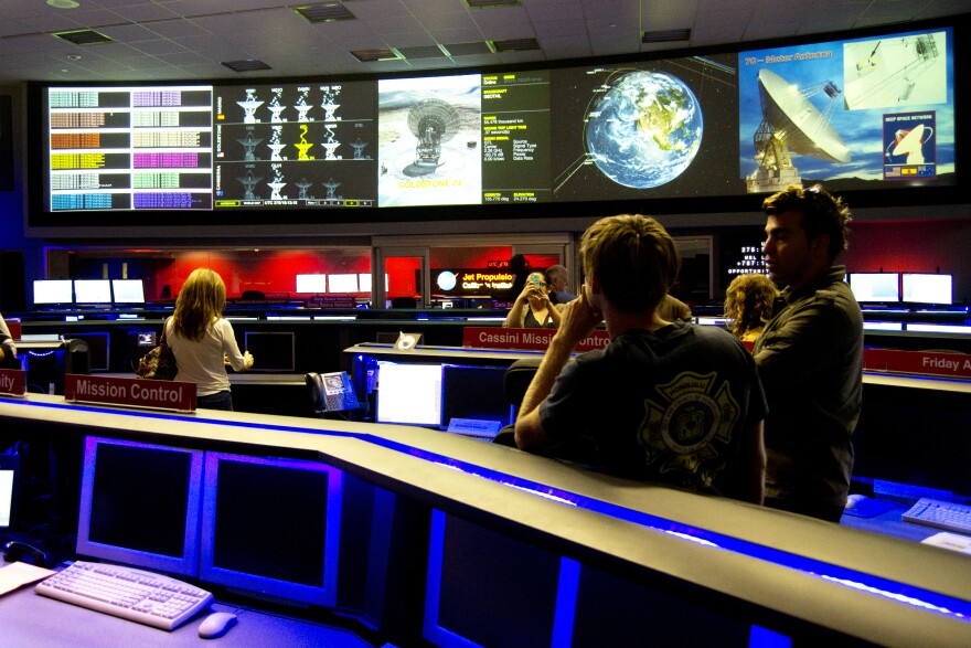 File: Visitors attend a public tour of NASA's Jet Propulsion Laboratory in Pasadena.