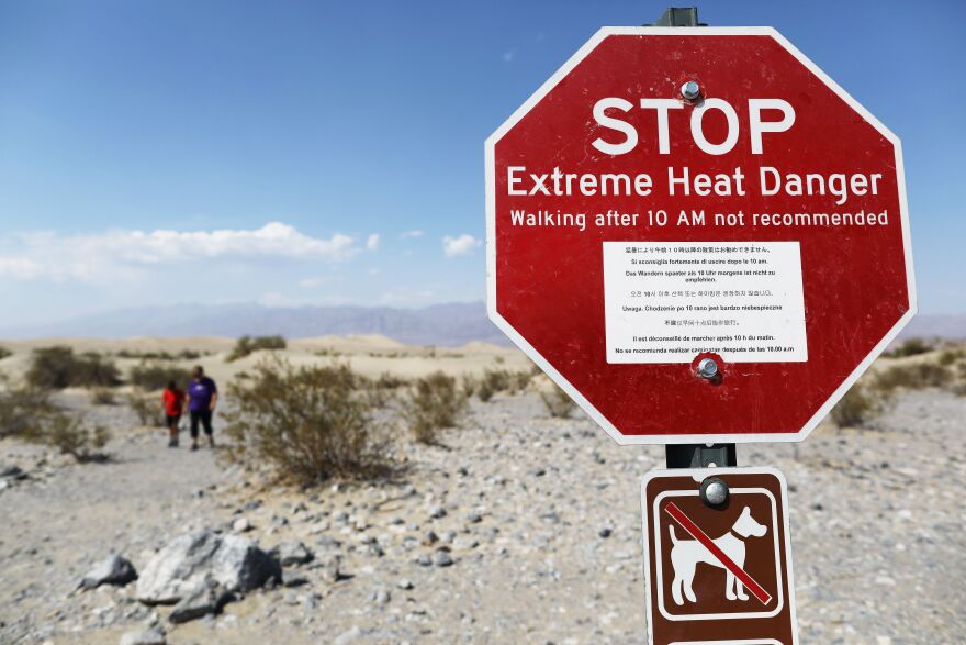 An image of a stop sign warning visitors of extreme heat.