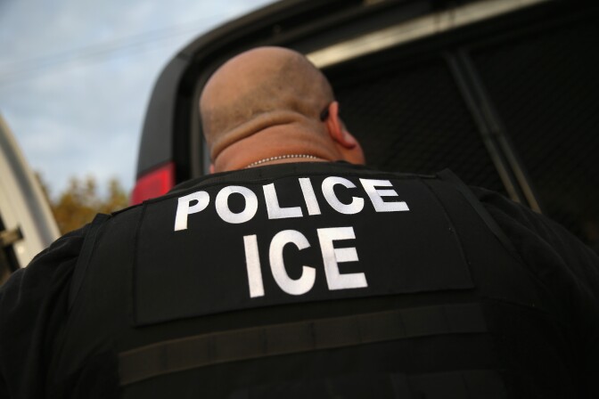 File: U.S. Immigration and Customs Enforcement (ICE) agents detain an immigrant on Oct. 14, 2015 in Los Angeles.