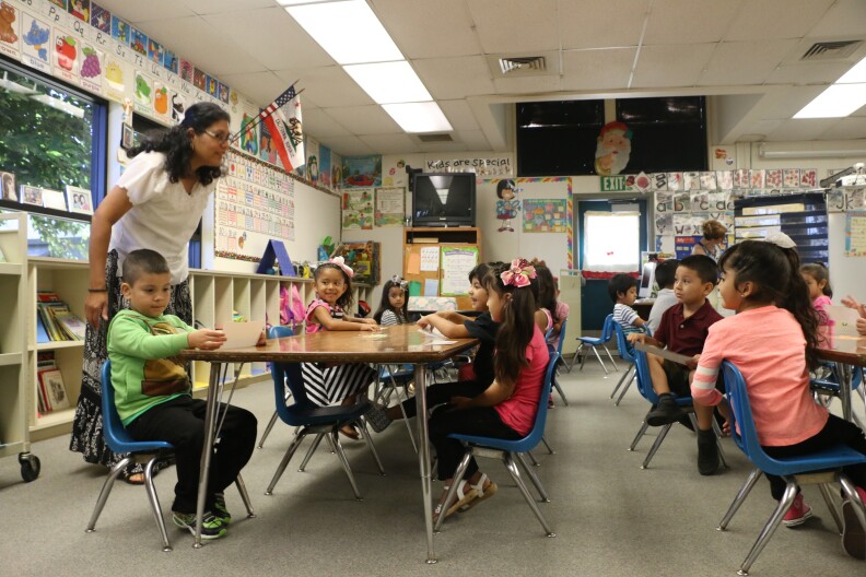 Martha Sanderson greets her kindergarten class on the the first day of school at Westside Elementary, Aug. 13, 2015.  