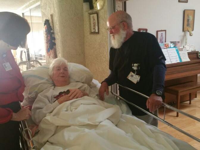 Hospice nurse Kurt Rice (right) and Teri Helton (left), program manager for Livingston Memorial Visiting Nurses Association, visit Shirley Sarah Heller in her Leisure Village home in Camarillo.
