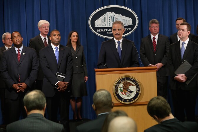 A California judge will hear arguments Monday on whether a $5 billion civil fraud lawsuit against credit ratings agency Standard & Poor's should be dismissed. (File photo: U.S. Attorney General Eric Holder at a news conference in February 2013 in which a civil lawsuit against S&P was announced over its pre-fiscal crisis bond ratings.)