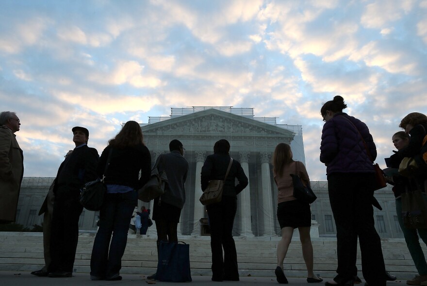 WASHINGTON, DC - OCTOBER 10:  People wait in line to enter the U.S. Supreme Court on October 10, 2012 in Washington, DC. Today the high court is scheduled to hear arguments on Fisher V. University of Texas at Austin, and are tasked with ruling on whether the university's consideration of race in admissions is constitutional.  (Photo by Mark Wilson/Getty Images)