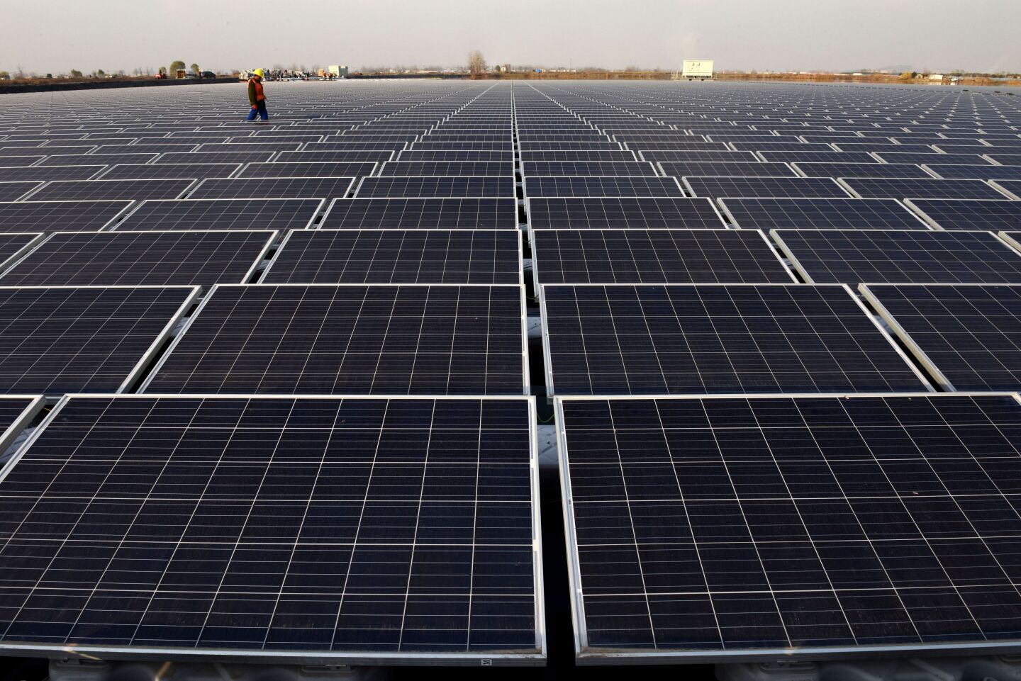 File: This photo taken on Dec. 11, 2017 shows a general view of a floating solar power plant in Huainan, a former coal-mining region, in China's eastern Anhui province.