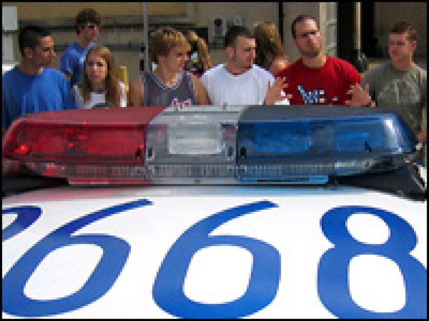 Protesting Gallaudet students block a Washington, D.C., police car from entering the campus Thursday.