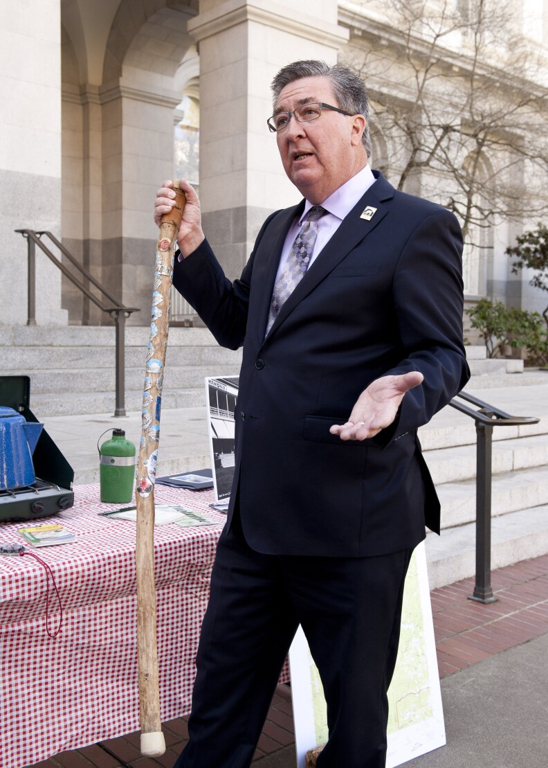 Assemblyman Ken Cooley (D-Rancho Cordova) with his walking stick from Yosemite National Park.