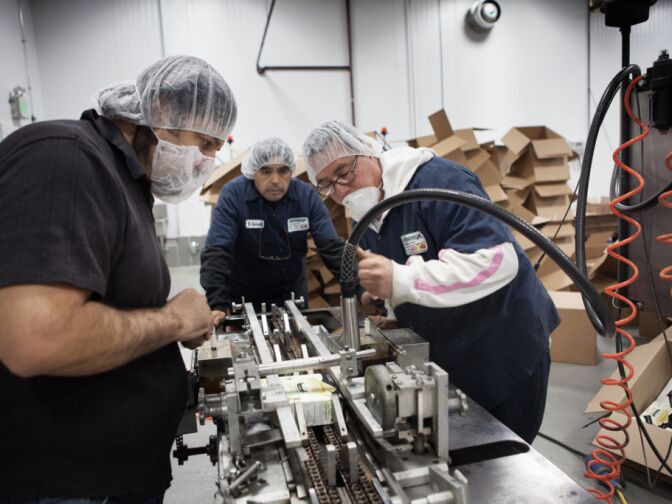 The Institute for Supply Management reported Monday that U.S. manufacturing activity grew in June behind a pickup in new orders, exports and production. (Photo: Employees at the Mikawaya factory inspect a broken piece of machinery at the Vernon, Calif. facility.)