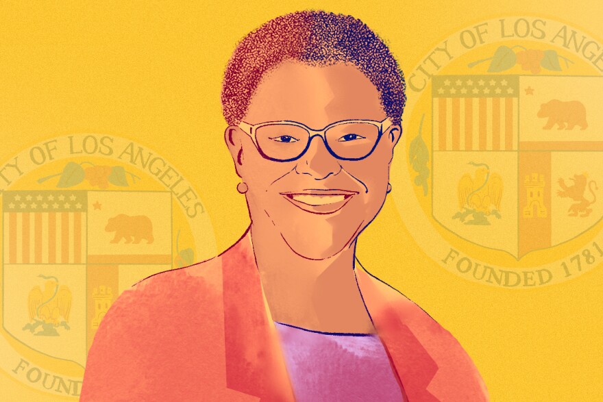 An illustrated headshot of incoming L.A. mayor Karen Bass. She is wearing a red blazer and glasses. Behind yet is a yellow background with an illustrated version of the L.A. city seal.