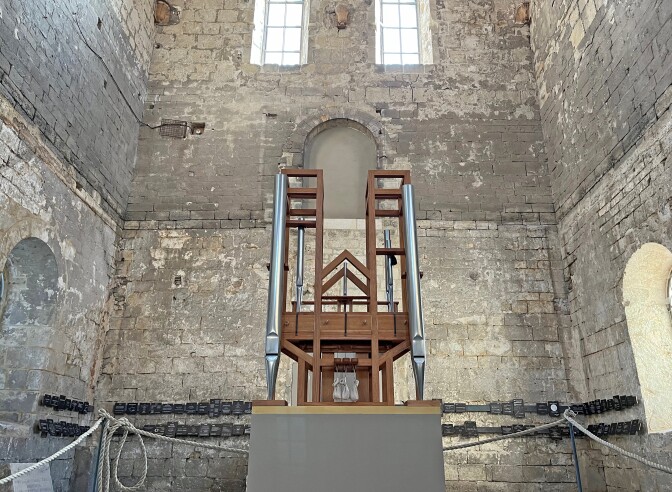 The wooden-framed organ that has played the composition since 2001 is a work in progress. It's being built as the piece goes on, with metal pipes added or taken away with each chord change. Its bellows, sitting across from the organ on a platform, are powered electrically, the wind from them carried to the organ through an underground pipe.