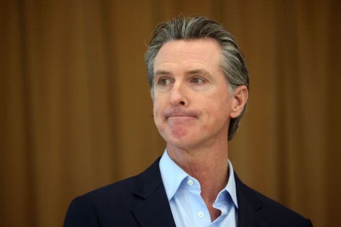 ALAMEDA, CALIFORNIA - MARCH 16: California Gov. Gavin Newsom looks on during a news conference after he toured the newly reopened Ruby Bridges Elementary School on March 16, 2021 in Alameda, California. Gov. Newsom is traveling throughout California to highlight the state's efforts to reopen schools and businesses as he faces the threat of recall. (Photo by Justin Sullivan/Getty Images)