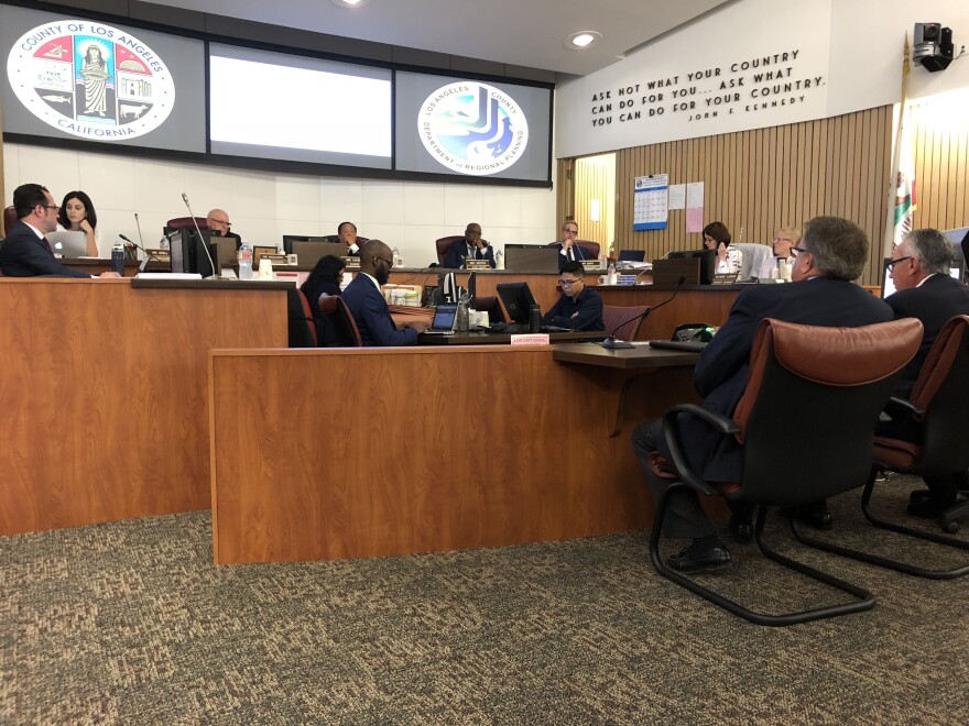 Commissioners listen as representatives from the Centennial Housing Project present their case for approval.