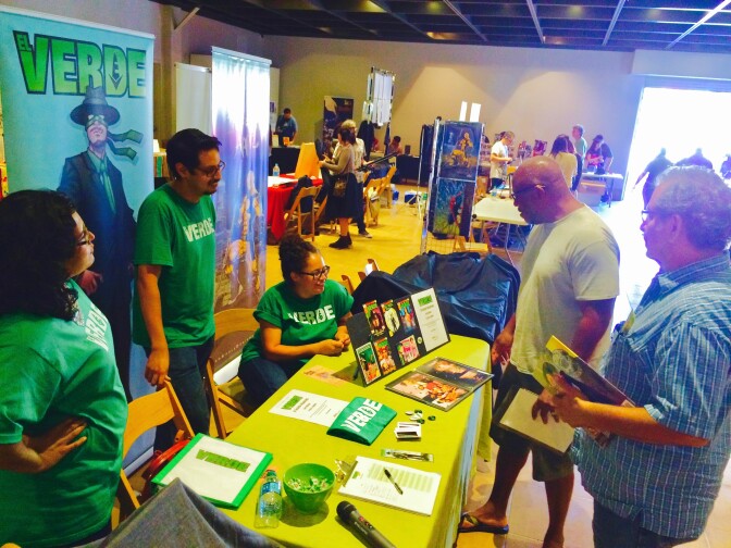 Anthony Aguilar (left) and “El Verde” co-creater Alejandra Cisneros (center) have publicized their brown story about a green-loving superhero for the past three Latino Comics Expos.