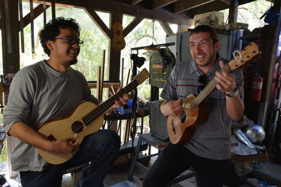 Cesar Castro and Chuy Sandoval play their instruments.