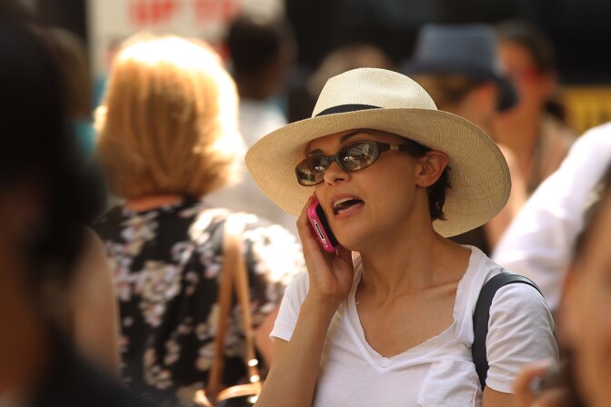 NEW YORK, NY - MAY 31:  A woman speaks on her mobile phone on May 31, 2011 in New York City.  In a new report by 31 scientists meeting at the World Health Organization's International Agency for Research on Cancer (WHO/IARC) it was found that using a mobile phone may increase your risk for certain kinds of brain cancers. While further scientific work will be conducted, the group of scientists from 14 countries classified cell phones in the carcinogenic category 2B, which is similar to the pesticide DDT and gasoline engine exhaust.  (Photo by Spencer Platt/Getty Images)