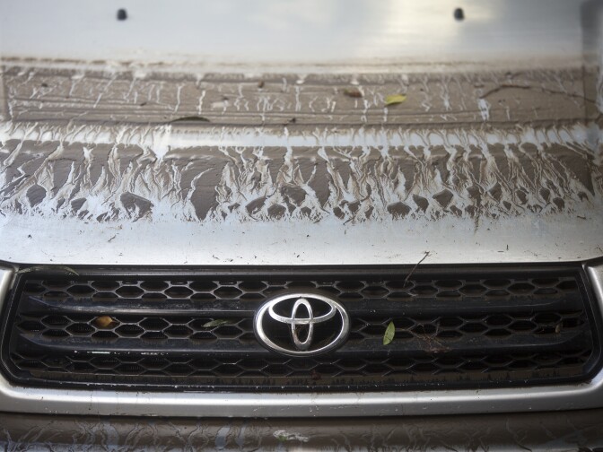 Sediment on a submerged car shows the previous water level after an 18-inch main burst in Hollywood early Wednesday morning, Feb. 18, 2015 releasing a torrent of water onto residential streets and submerging cars.