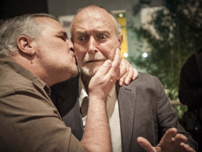 Surprised Llyn Foulkes son-kissed by artist/son Bruce Gray, 2-2-2013 at Hammer opening.
