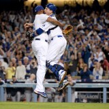 LOS ANGELES, CA - OCTOBER 07:  Catcher A.J. Ellis #17 and Kenley Jansen #74 of the Los Angeles Dodgers celebrate after the Dodgers defeat the Atlanta Braves 4-3 in Game Four of the National League Division Series at Dodger Stadium on October 7, 2013 in Los Angeles, California.  (Photo by Harry How/Getty Images)