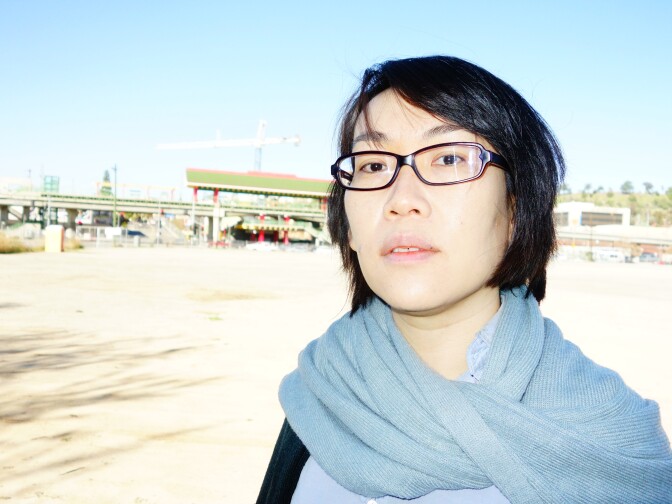 Sissy Trinh, with the youth organizing group South East Asian Community Alliance, helped write new land use rules for the Chinatown and Lincoln Heights areas, including this 5-acre parcel at College and Spring streets. The owner proposes to build nearly 700 homes there, she would prefer far fewer homes.