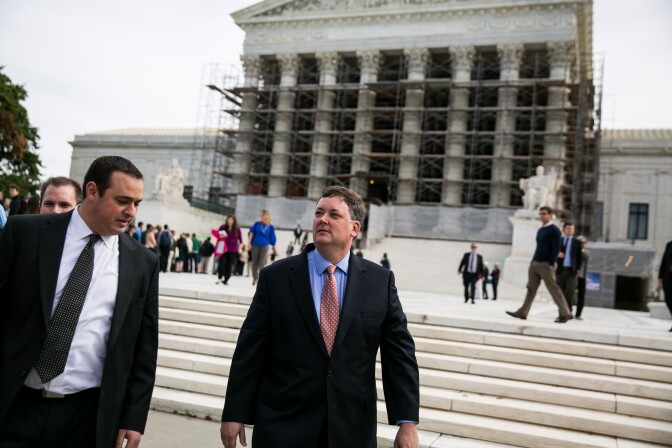 WASHINGTON, DC - OCTOBER 8:  Shaun McCutcheon (C) plaintiff in a case of McCutcheon v. Federal Election Commission, leaves the Supreme Court on October 8, 2013 in Washington, DC. The court heard oral arguments in McCutcheon v. Federal Election Committee, a first amendment case that will determine how much money an individual can contribute directly to political campaigns. (Photo by Drew Angerer/Getty Images)