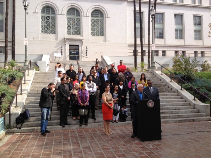 LA City Council members Mike Bonin, center, Nury Martinez, left, and Current Price propose a higher minimum wage for hotel workers. 