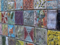 Kids with and without special needs worked together to design the ceramic tiles that make up this mural.
