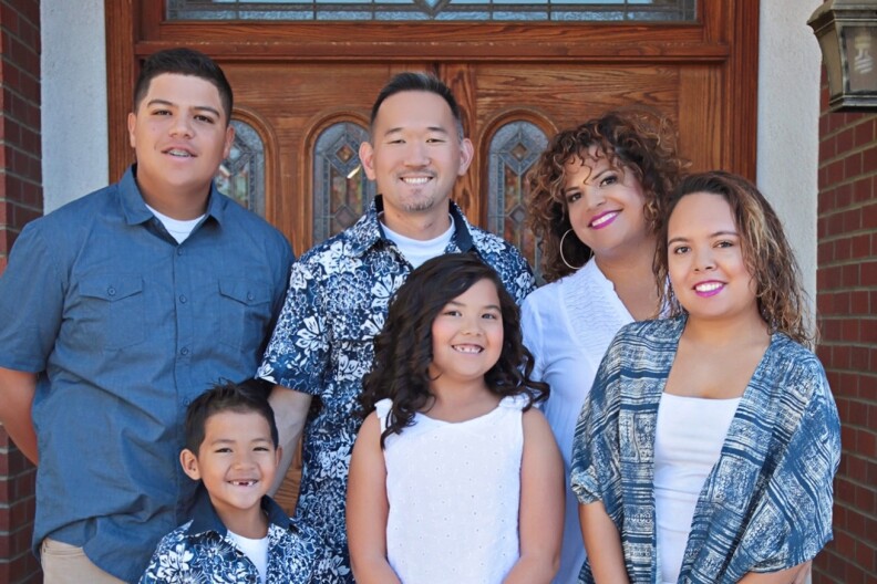 Sonia Smith Kang (back row right) poses with her multiracial, multicultural family. She is Mexican-black, and her husband is Korean.