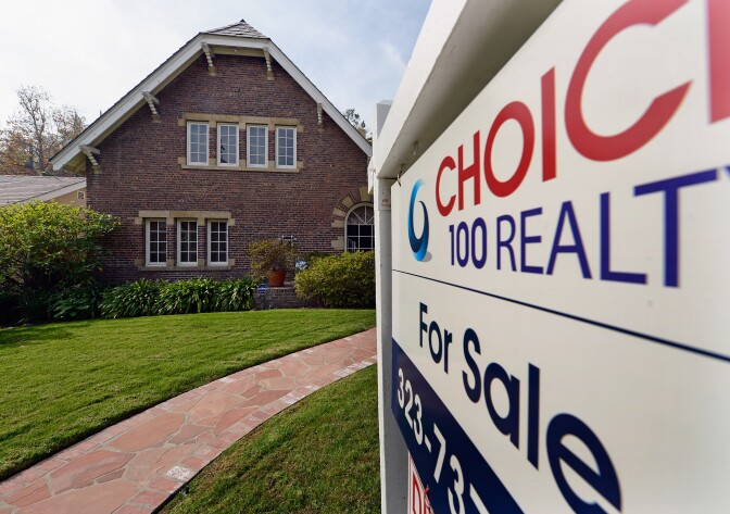 LOS ANGELES, CA - NOVEMBER 27:  A "For Sale" sign is posted in front of a house on November 27, 2012 in Los Angeles, California. According to S&P Index reports, for the month of September home prices in major U.S. cities have risen as much as 3 percent as compared with the same month last year.  (Photo by Kevork Djansezian/Getty Images)