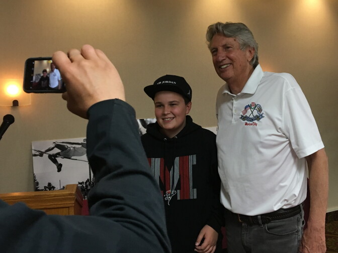 Former Olympic high jump champion Dick Fosbury posed with Cooper Cox of Medford, Ore. during a book signing appearance in 2018. Fosbury, who grew up in Medford, won the high jump gold medal at the 1968 Mexico City Olympics and set an Olympic and U.S. record at the time.