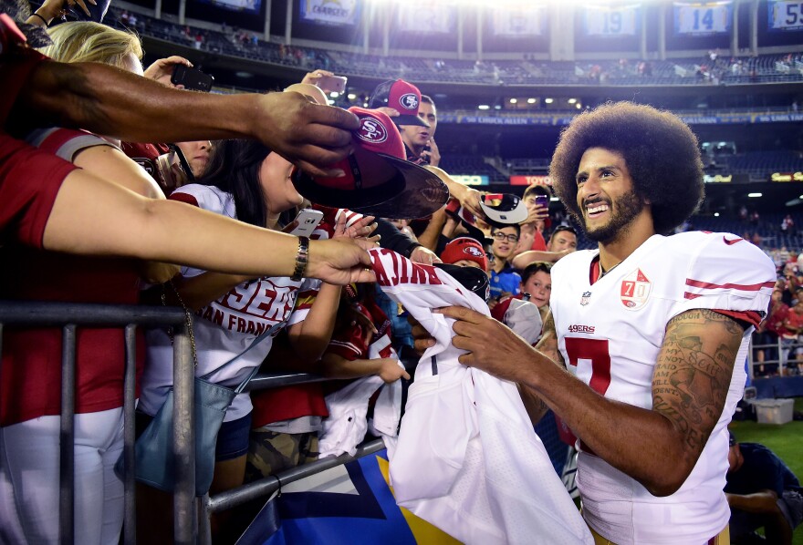 SAN DIEGO, CA - SEPTEMBER 01:  Colin Kaepernick #7 of the San Francisco 49ers signs autographs for fans after a 31-21 win over the San Diego Chargers during a preseason game at Qualcomm Stadium on September 1, 2016 in San Diego, California.  (Photo by Harry How/Getty Images)