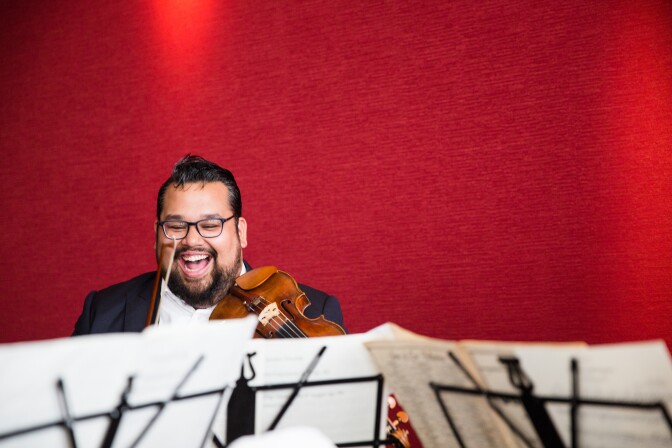Vijay Gupta, Founder and Artistic Director of Street Symphony, plays the violin at a Laemmle Live community event in Santa Monica.