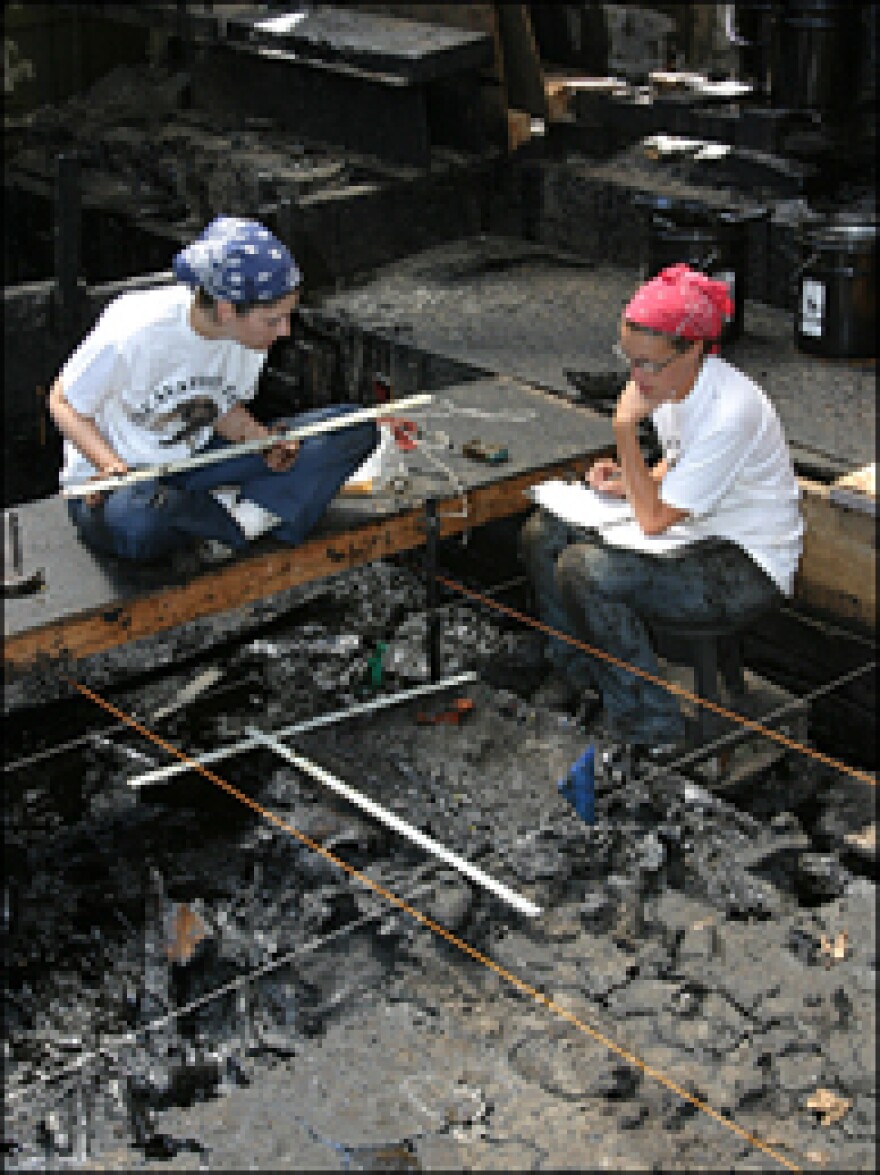 Excavators Kristen Vowels and Samantha Green looking for fossils at Pit 91 at the La Brea Tar Pits.