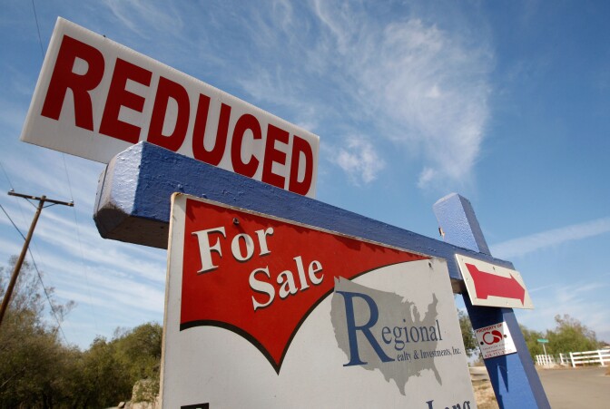 RAMONA, CA - OCTOBER 30:  A real estate for sale sign offers a reduced price October 30, 2007 in Ramona, California. August home prices fell for the eighth consecutive month across the United States with Tampa, Florida leading the way for metropolitan cities with a 10.1 percent decline.  (Photo by Justin Sullivan/Getty Images)