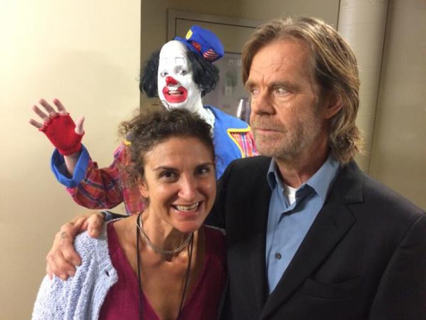 William H. Macy spoke with Take Two's Alex Cohen last week about directing his first film. Caption this photo of a clown photobombing them. 