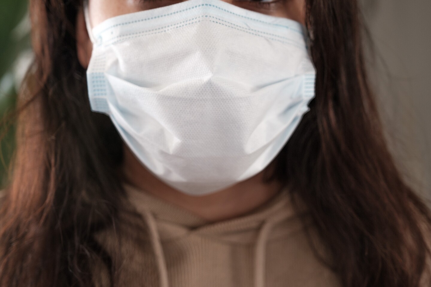 An image of a woman with a mask.