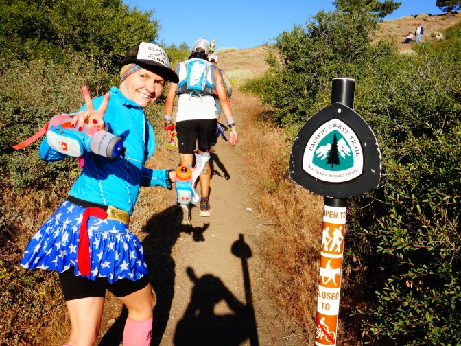                                Ultrarunner Martine Sesma is in good spirits as she passes through the Inspiration Point aid station of the Angeles Crest 100 ultramarathon on the Pacific Crest Trail.