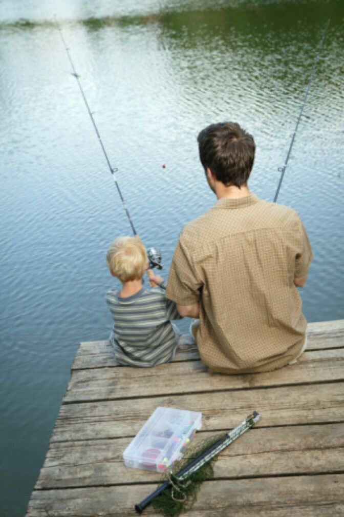 Stock photo of father and son fishing.