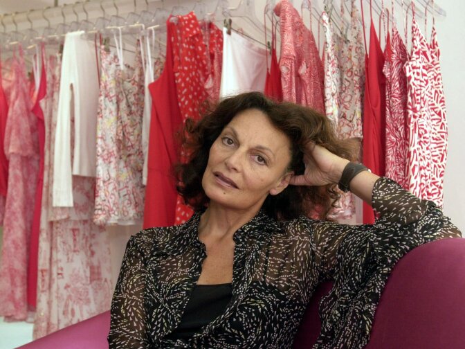 Wearing one of her signature wrap dresses from her fall collection, designer Diane Von Furstenberg poses July 10, 2001, in her New York shop. 