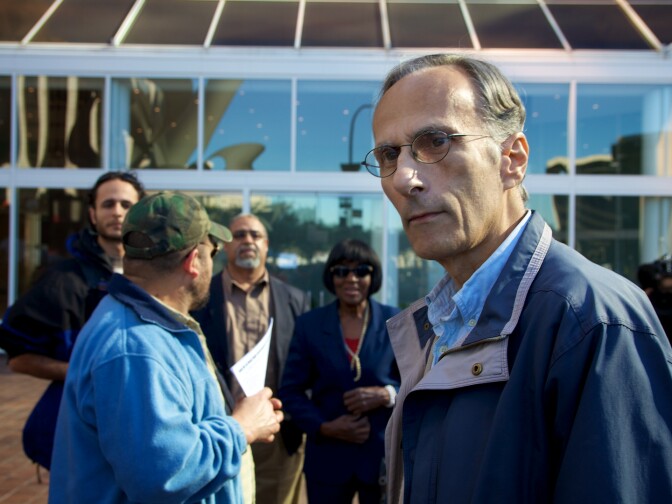 Dominic Peppe of downtown LA, interrupted the press conference to shout at Occupy organizers because he was not allowed to enter the bank after guards closed the doors for security reasons.