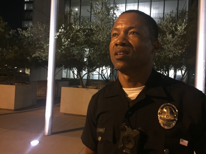 Officer Dave Bowen, who walks a foot beat downtown, is one of more than 4,000 LAPD cops who wear body cams attached to his shirt between the two pockets.