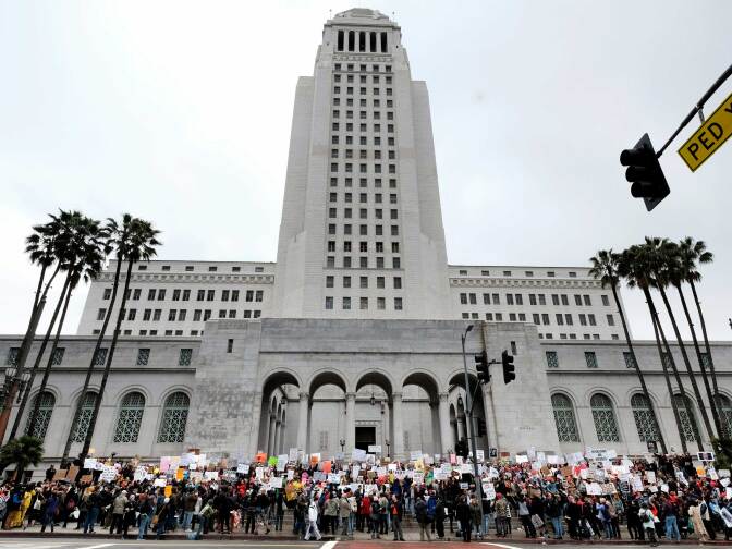 Protesters stand on the steps of Los Angeles City Hall on Monday, Feb. 20, 2017. Demonstrators gathered to express their opposition to President Donald Trump and take part in a "Not My President's Day" rally. 